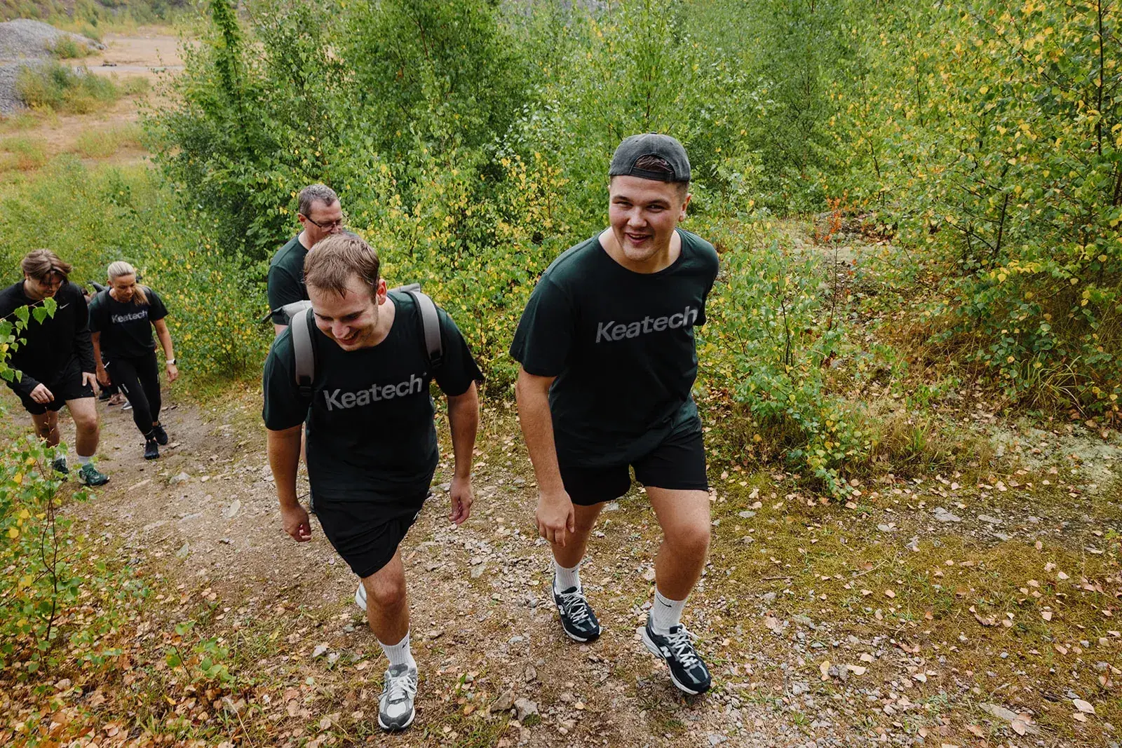 Keatech team members hiking in branded shirts