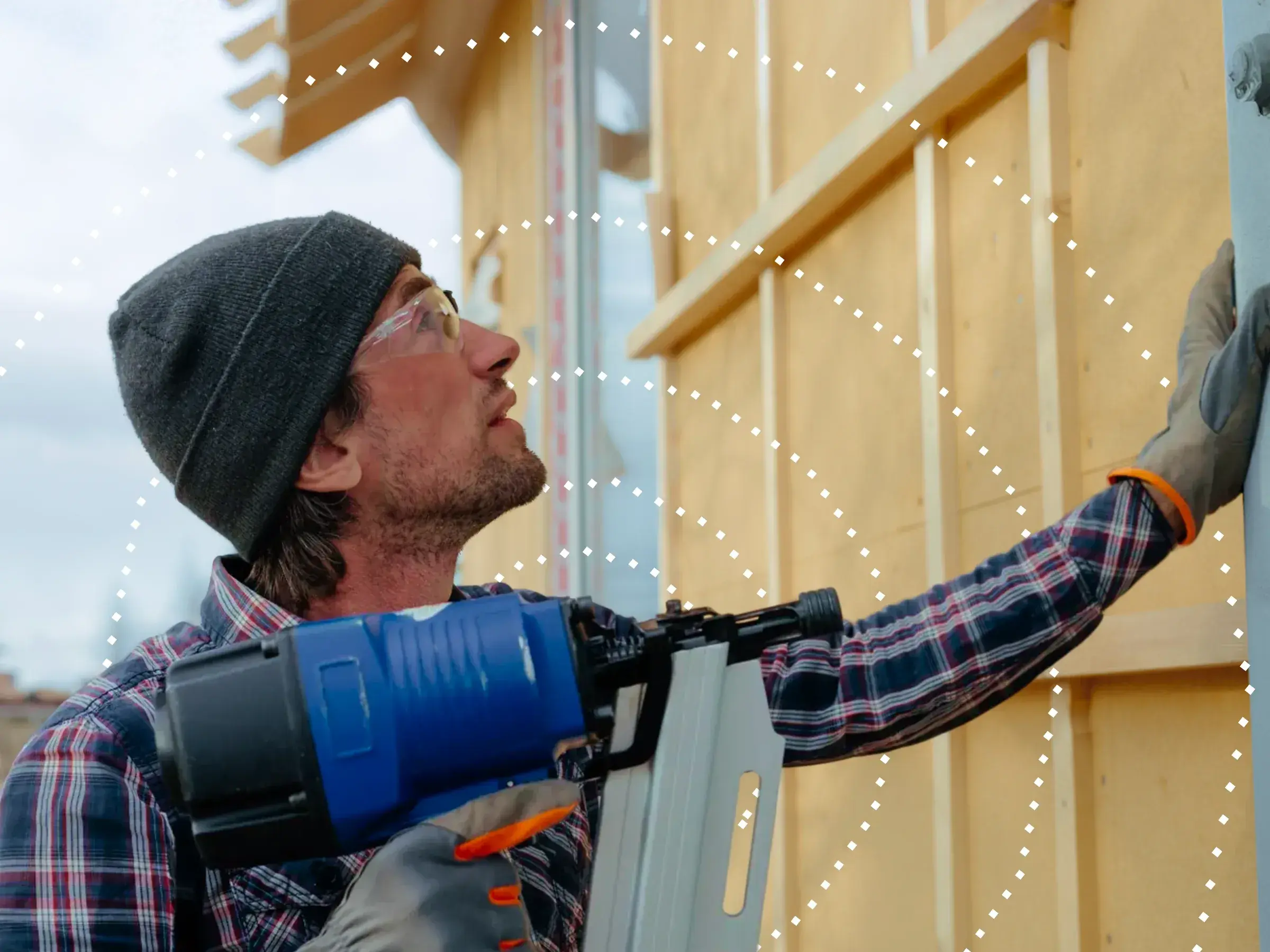 Worker using power tools on a construction site