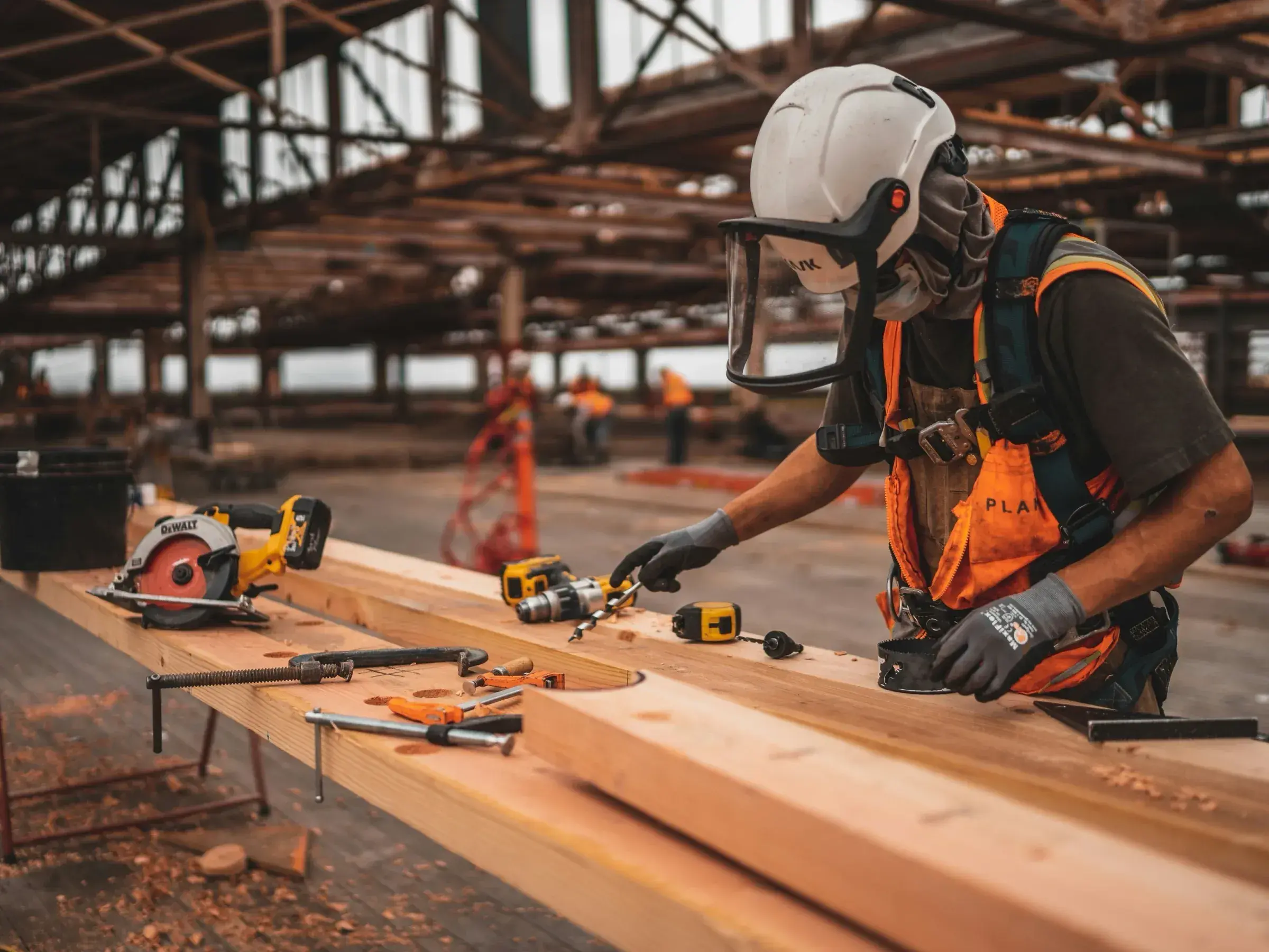 Construction worker using tools on a worksite